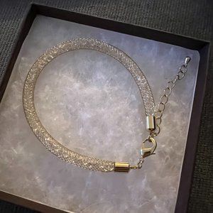 Gold bracelet with Swarovski Crystals. New with box!